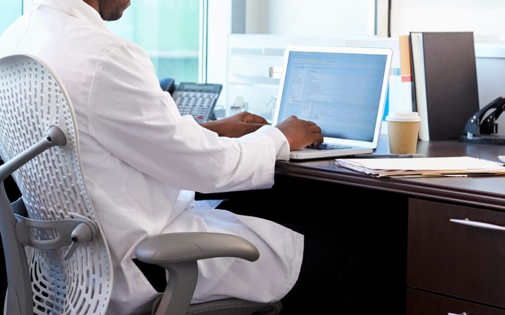 person typing on a laptop