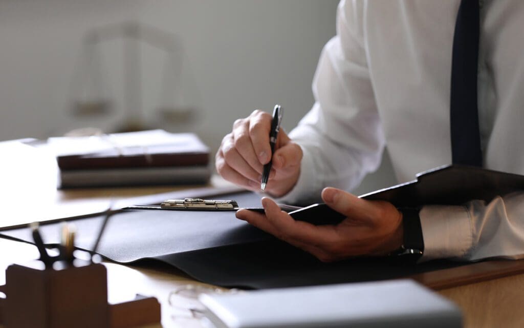 person writing in a notebook