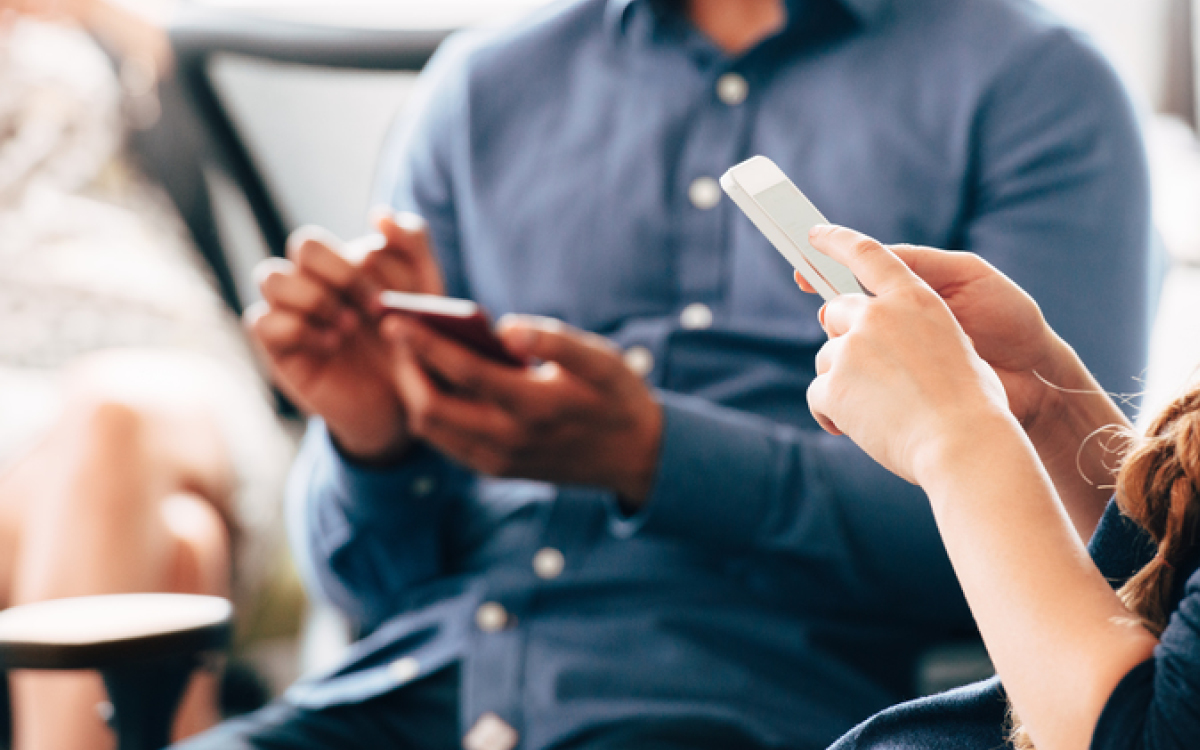 two people on their phones